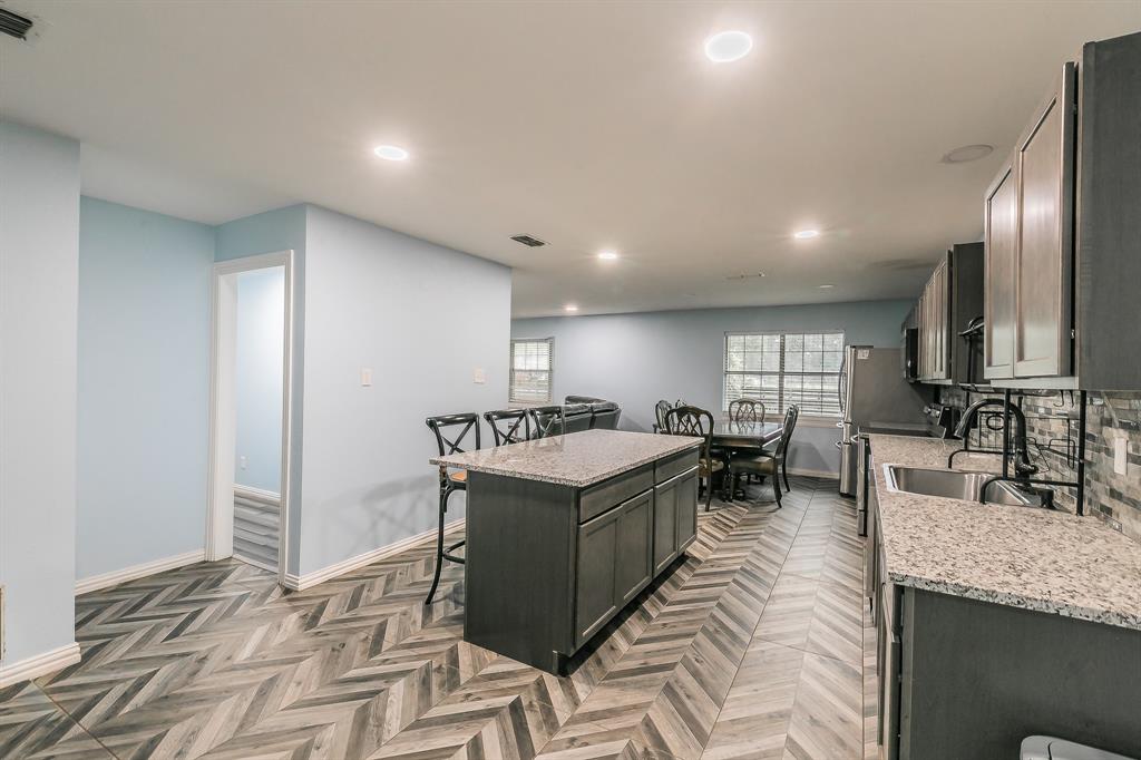 904 Sherman Street Tioga, TX 76271 - Photo 34 of 40 a living room with stainless steel appliances granite countertop furniture and a kitchen view