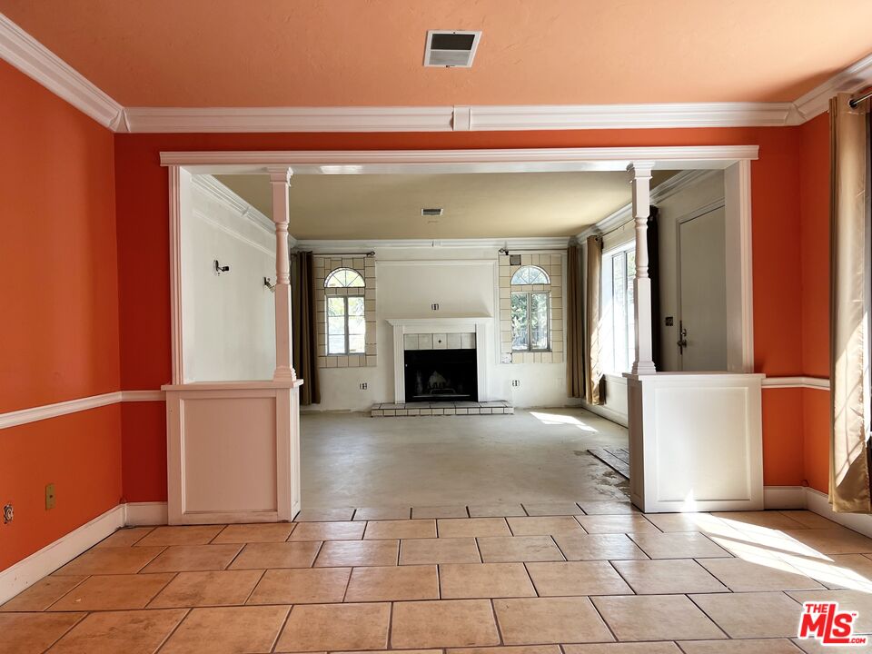 1151 Forest Avenue Pasadena, CA 91103 - Photo 5 of 15 a view of a livingroom with an empty space and a fireplace