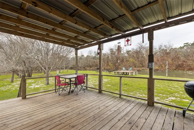 a view of sitting area with furniture and wooden floor