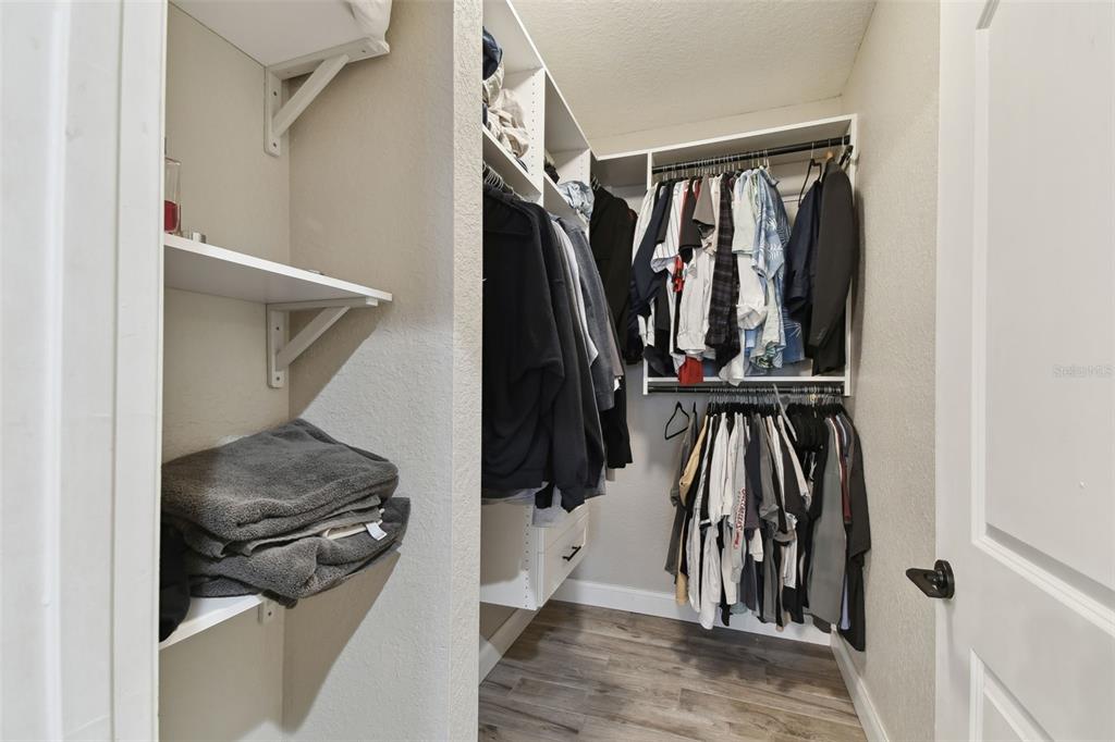 4221 West Spruce Street, Unit 1404 Tampa, FL 33607 - Photo 14 of 16 a view of walk in closet with clothes and shoes