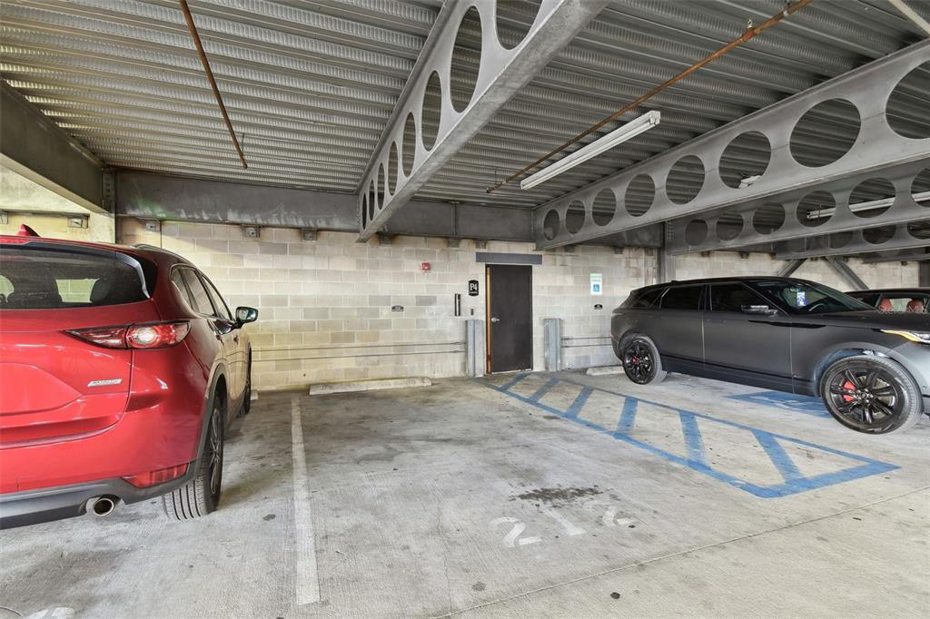 4221 West Spruce Street, Unit 1404 Tampa, FL 33607 - Photo 16 of 16 a view of a garage with car parked