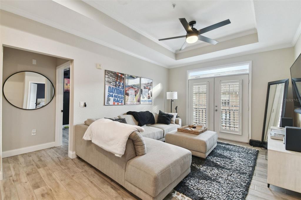 4221 West Spruce Street, Unit 1404 Tampa, FL 33607 - Photo 2 of 16 a bed room with bed and a large window