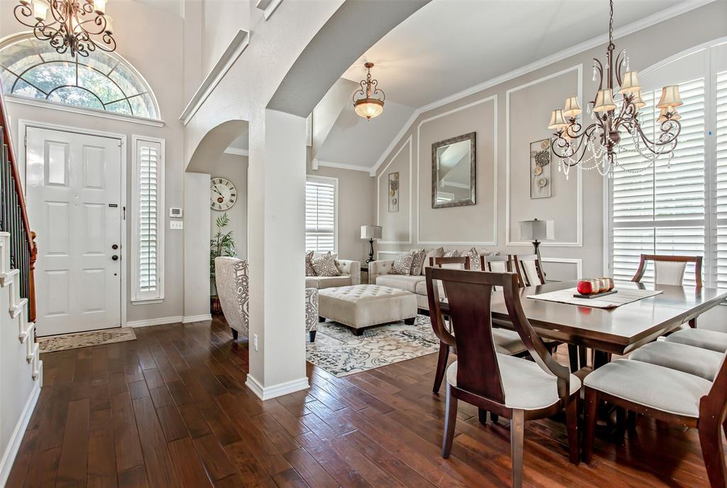 5916 Mossbrook Trail Dallas, TX 75252 - Photo 2 of 40 a view of a dining room with furniture and wooden floor