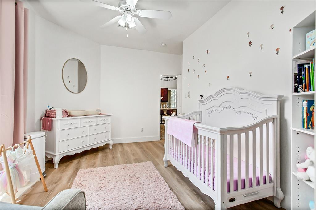 5916 Mossbrook Trail Dallas, TX 75252 - Photo 21 of 40 a view of a bedroom with furniture and white walls