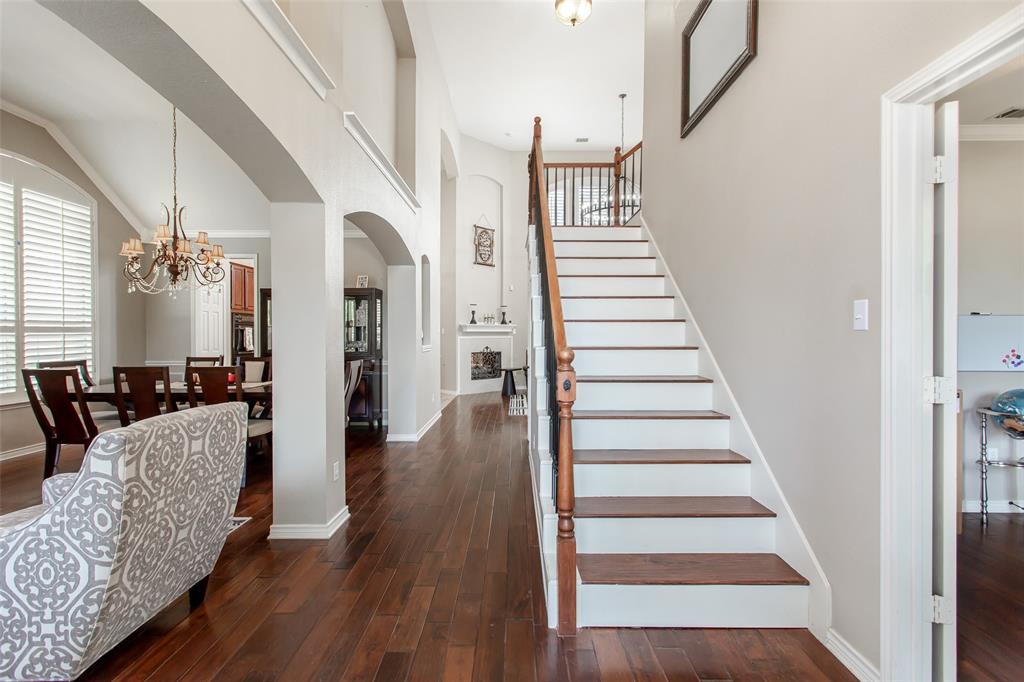 5916 Mossbrook Trail Dallas, TX 75252 - Photo 26 of 40 a view of entryway and hall with wooden floor