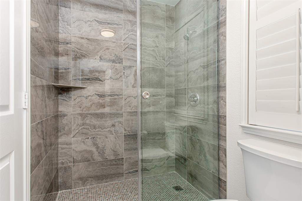 5916 Mossbrook Trail Dallas, TX 75252 - Photo 29 of 40 a bathroom with a shower
