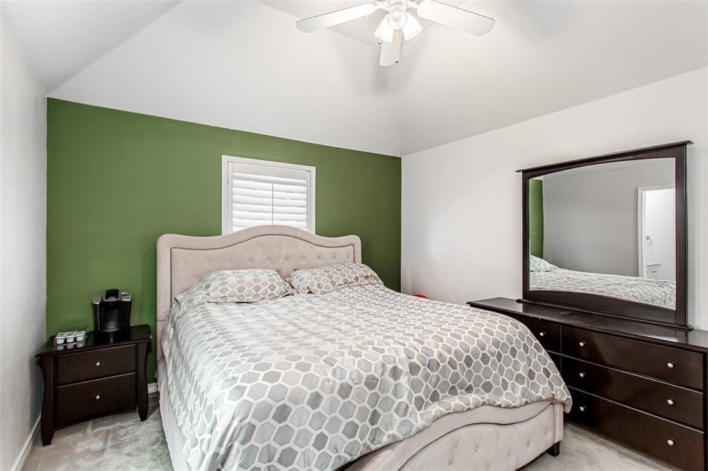 5916 Mossbrook Trail Dallas, TX 75252 - Photo 30 of 40 a bedroom with a bed and a mirror on dresser