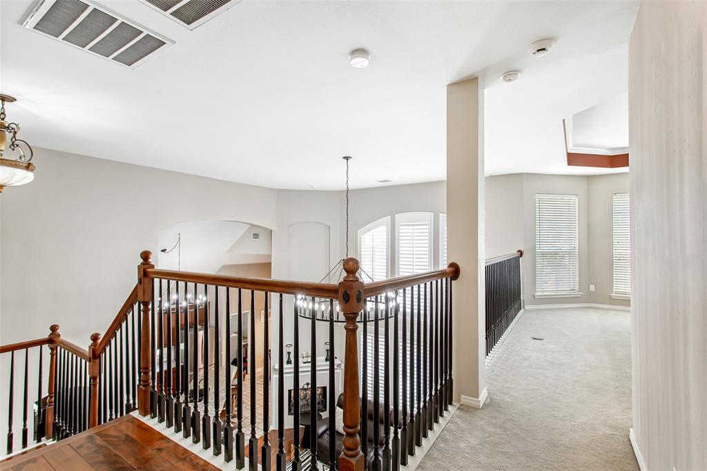 5916 Mossbrook Trail Dallas, TX 75252 - Photo 33 of 40 a view of a porch with wooden floor and windows