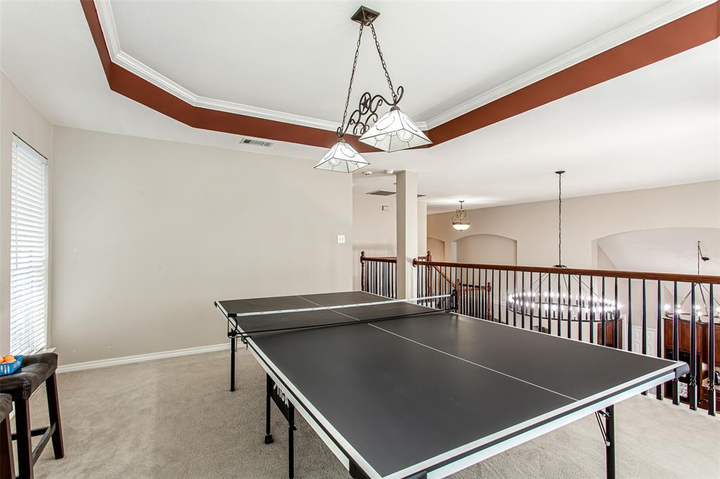 5916 Mossbrook Trail Dallas, TX 75252 - Photo 35 of 40 a view of a room with shelves and wooden floor