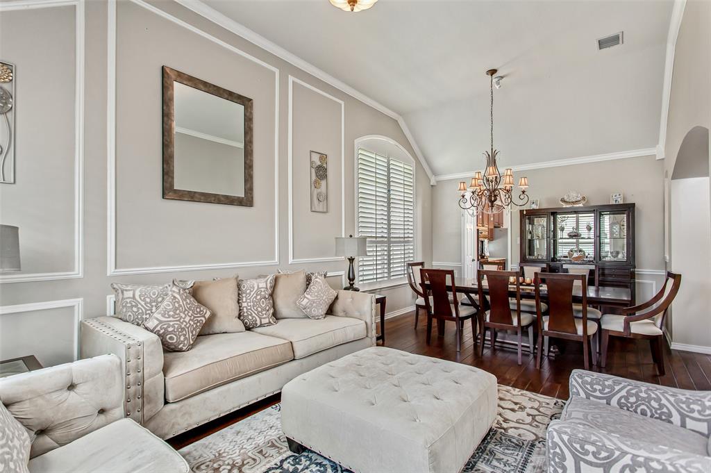 5916 Mossbrook Trail Dallas, TX 75252 - Photo 4 of 40 a living room with lots of furniture and wooden floor