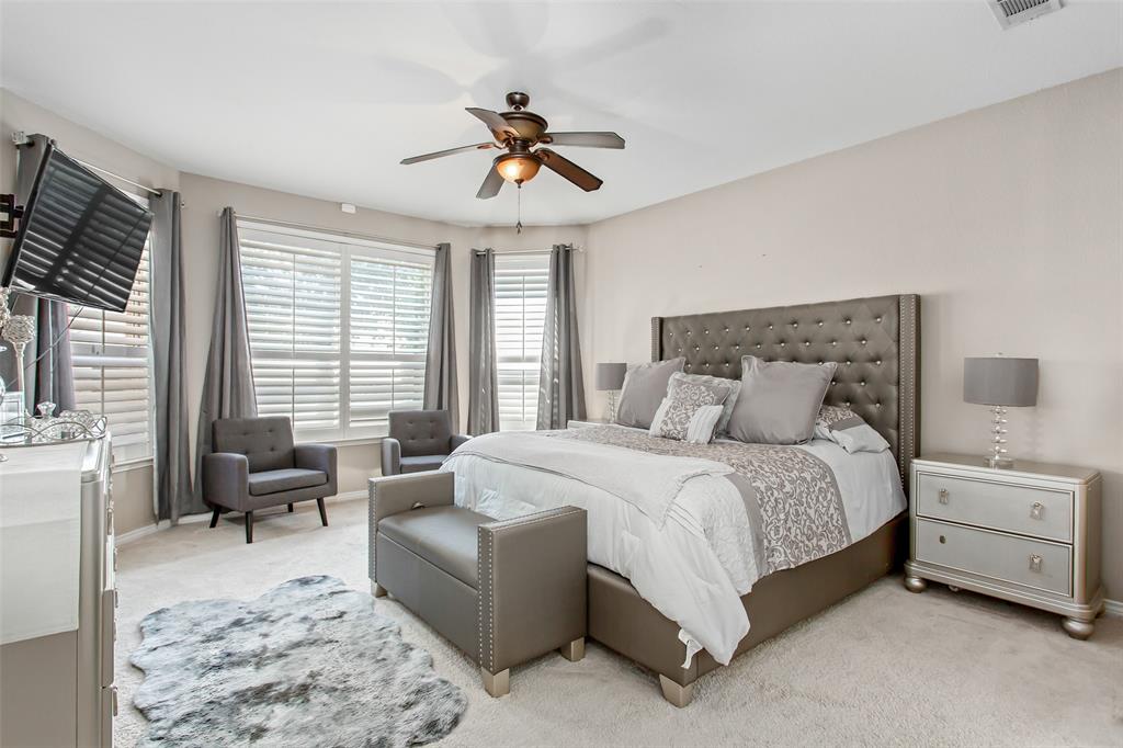 5916 Mossbrook Trail Dallas, TX 75252 - Photo 10 of 40 a spacious bedroom with a bed a couch and large windows
