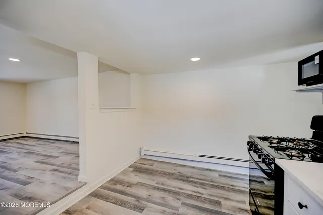 a kitchen with a stove and a refrigerator