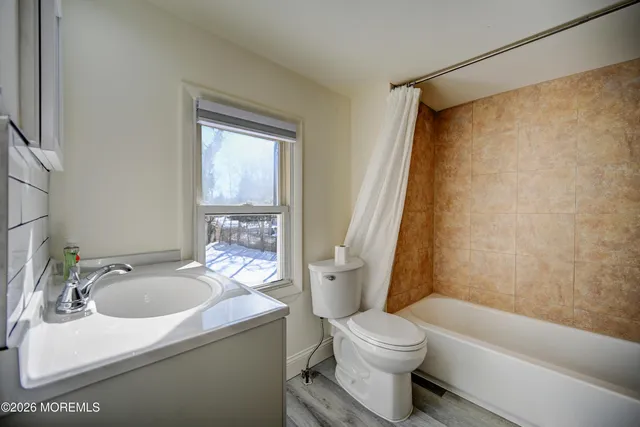 a utility room with a sink dryer and washer