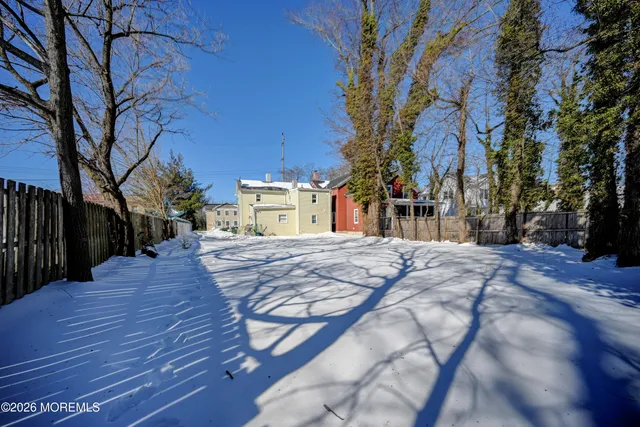a view of a yard with a tree