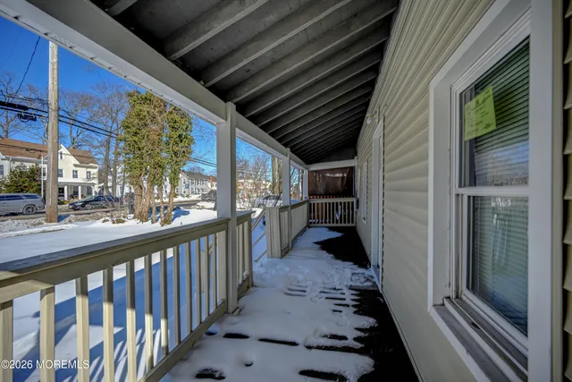 a view of a balcony with wooden floor