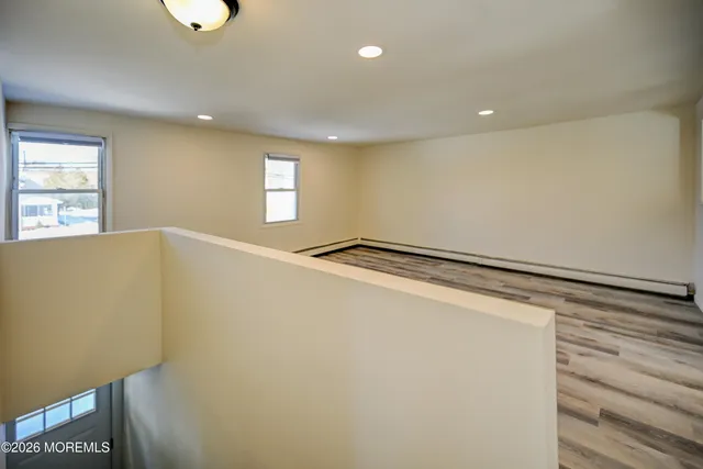 a view of an empty room and a window