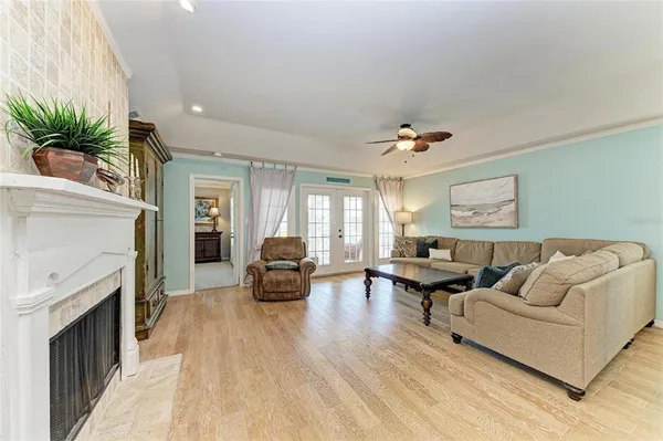 a living room with furniture and a fireplace