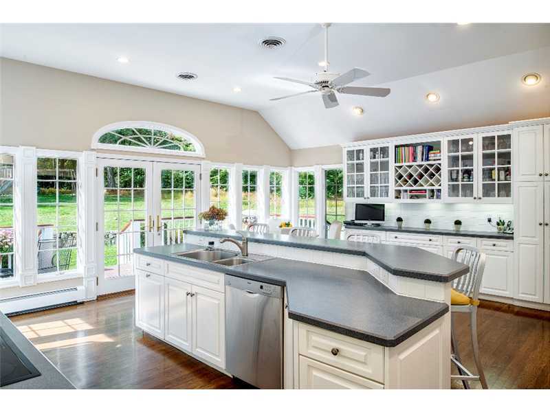 540 Cheese Spring Road New Canaan, CT 06840 - Photo 8 of 25 a kitchen with a sink stove and cabinets