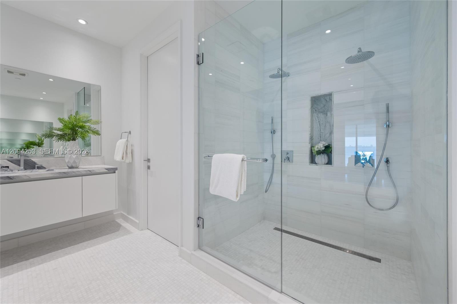 700 Northeast 26th Terrace, Unit TH403 Miami, FL 33137 - Photo 25 of 85 a bathroom with a shower and a sink
