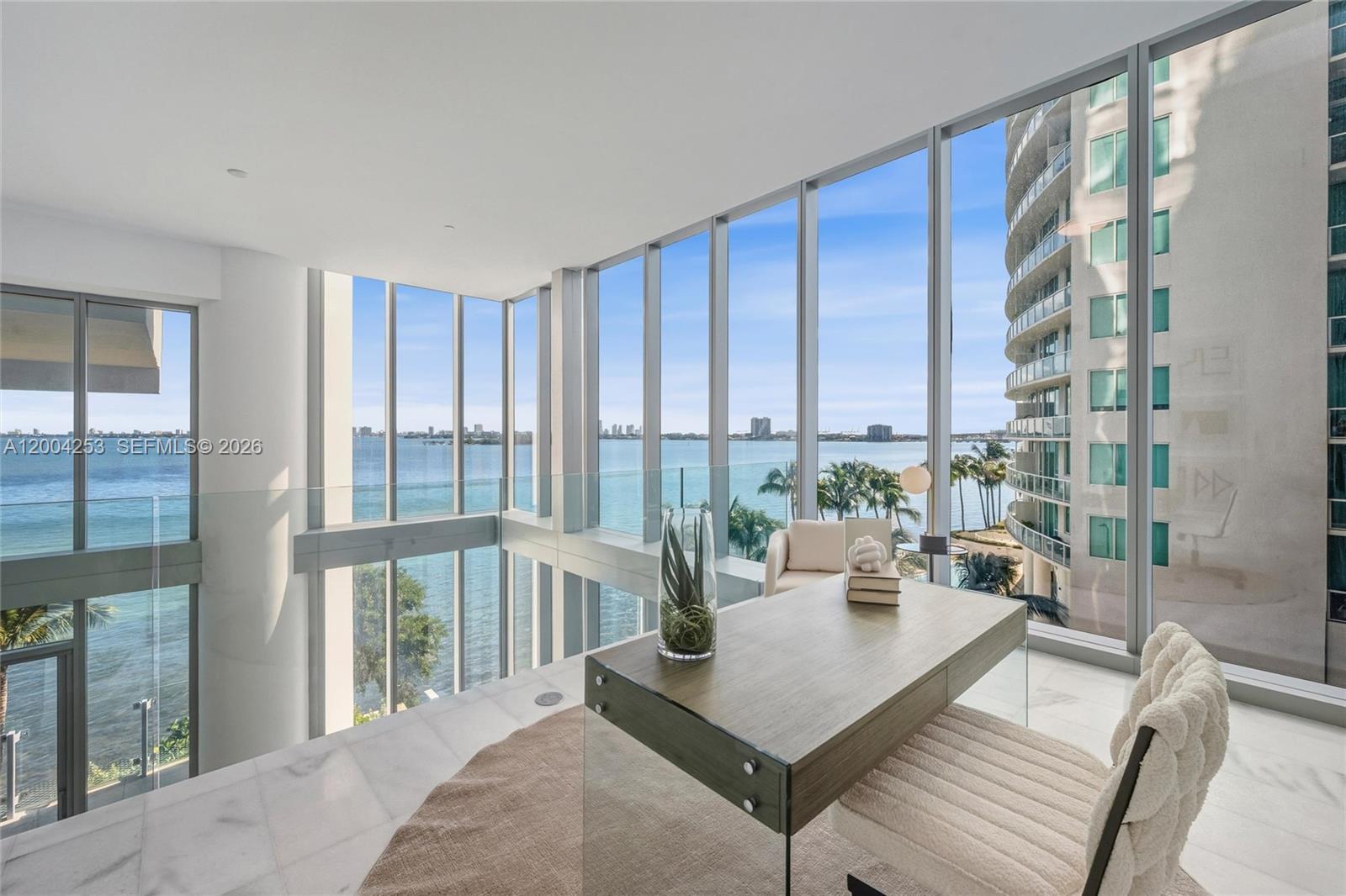 700 Northeast 26th Terrace, Unit TH403 Miami, FL 33137 - Photo 35 of 85 a living room with furniture and large windows
