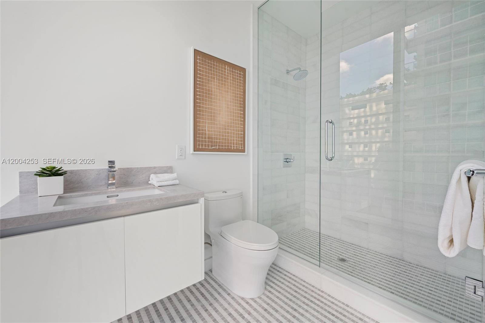 700 Northeast 26th Terrace, Unit TH403 Miami, FL 33137 - Photo 37 of 85 a bathroom with a sink a toilet and shower