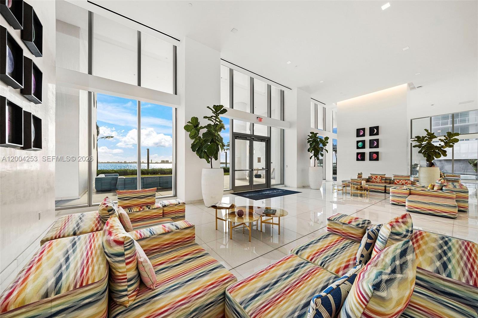 700 Northeast 26th Terrace, Unit TH403 Miami, FL 33137 - Photo 49 of 85 a view of a livingroom with furniture and floor to ceiling window