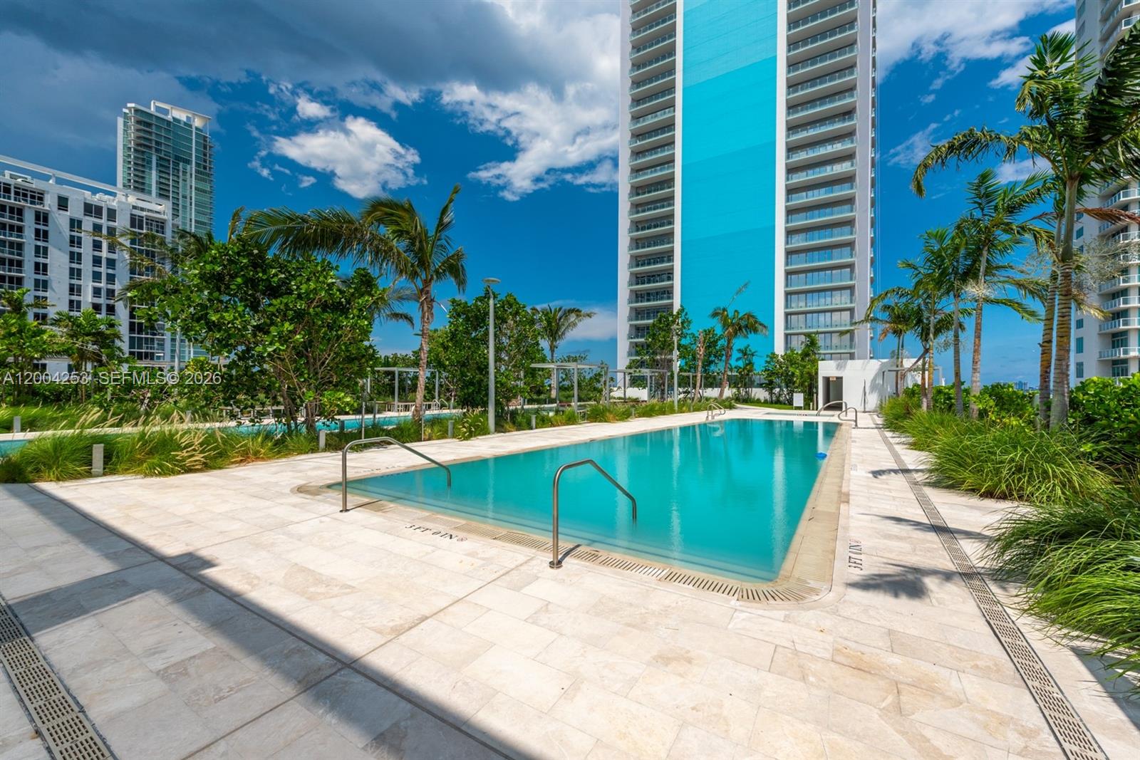 700 Northeast 26th Terrace, Unit TH403 Miami, FL 33137 - Photo 79 of 85 a house with palm tree in front of it