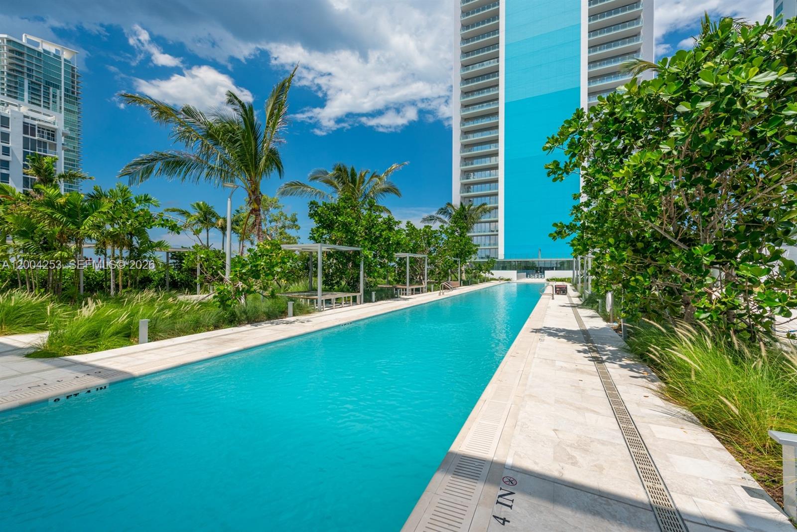 700 Northeast 26th Terrace, Unit TH403 Miami, FL 33137 - Photo 81 of 85 a view of a garden with a fountain