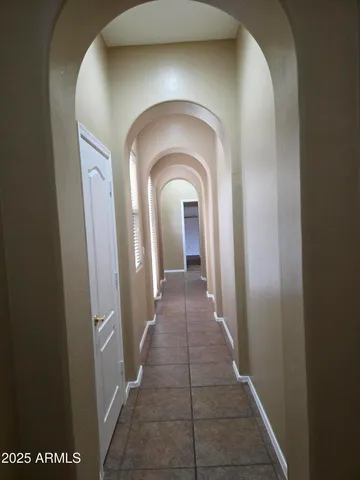 a kitchen with stainless steel appliances granite countertop a sink a refrigerator and a stove