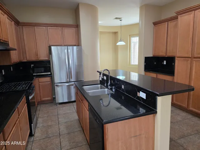 a view of a room with a windows and chandelier