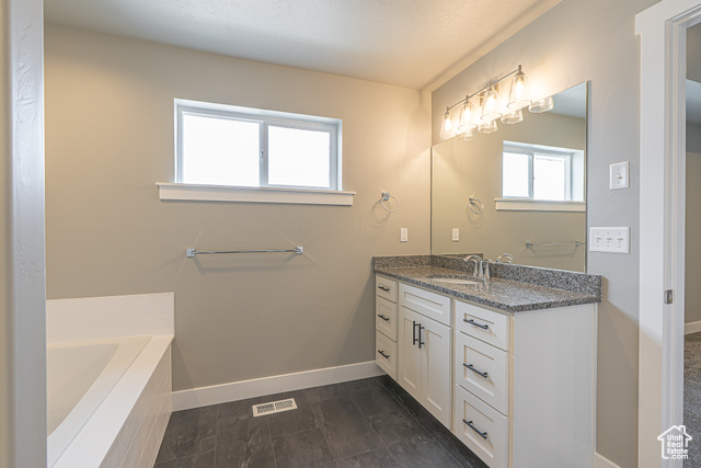 2242 South 1120 West, Unit 69 Logan, UT 84321 - Photo 23 of 26 Bathroom with a bath and vanity