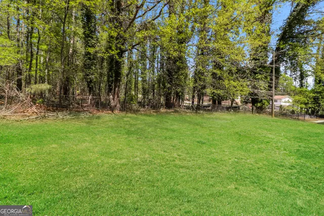 a backyard of a house with lots of green space