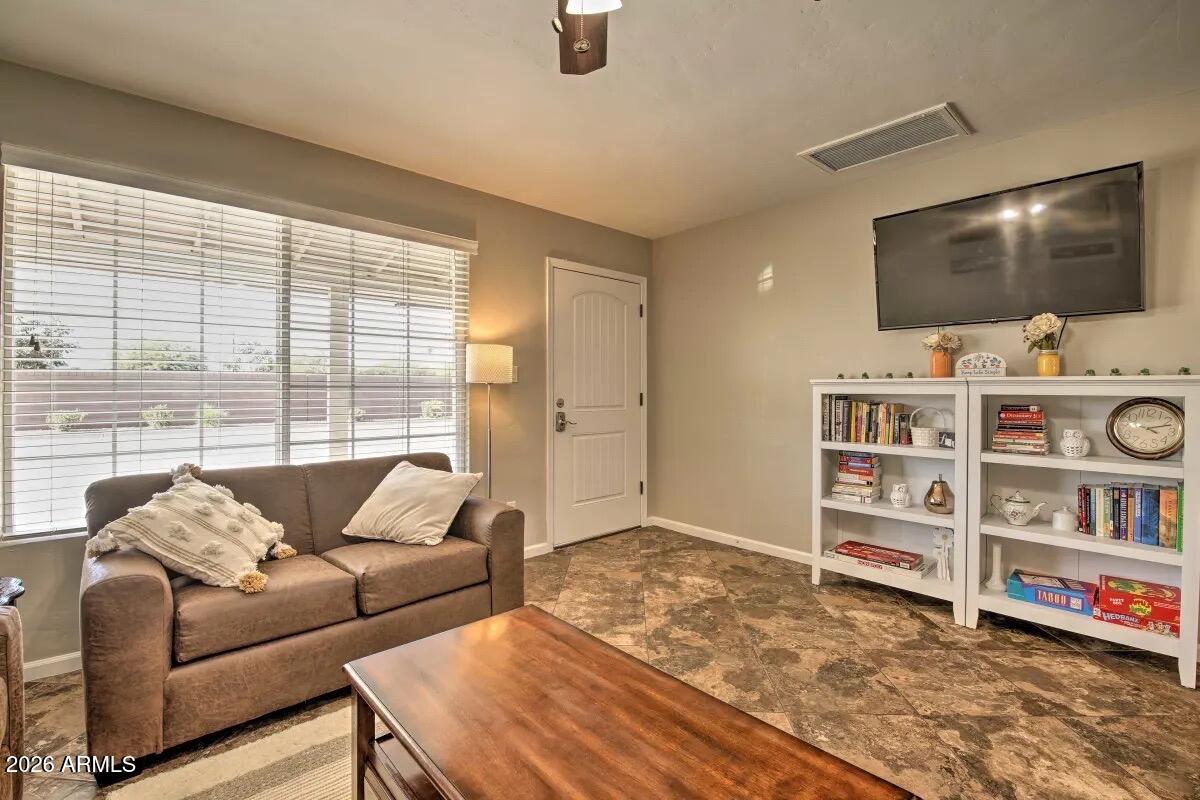 609 South Priest Drive Tempe, AZ 85281 - Photo 11 of 29 a living room with furniture and a flat screen tv
