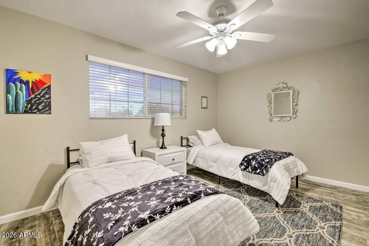 609 South Priest Drive Tempe, AZ 85281 - Photo 20 of 29 a bedroom with two beds and a window