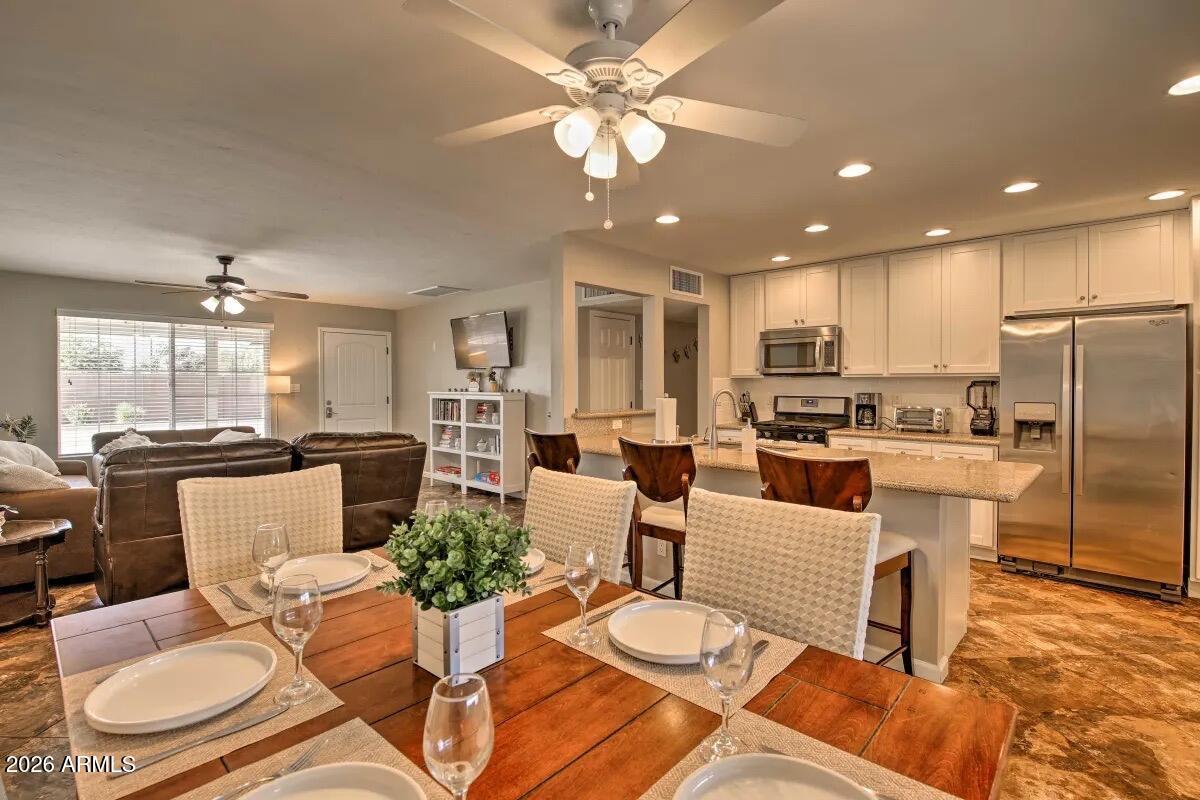 609 South Priest Drive Tempe, AZ 85281 - Photo 2 of 29 a living room with furniture kitchen view and a chandelier