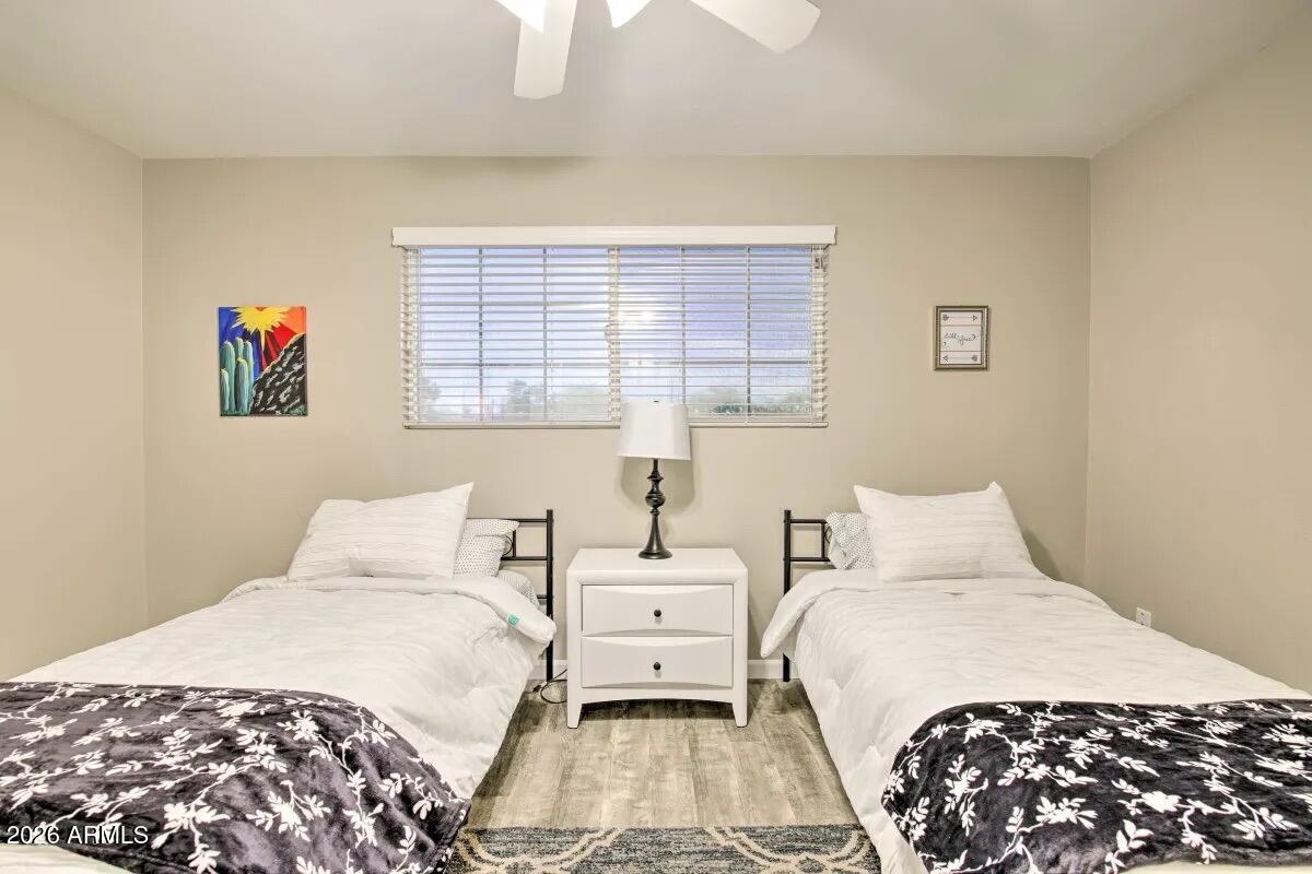609 South Priest Drive Tempe, AZ 85281 - Photo 21 of 29 a bedroom with a bed and a window