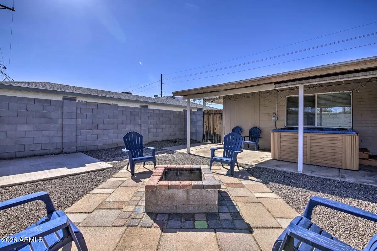 609 South Priest Drive Tempe, AZ 85281 - Photo 27 of 29 a view of a patio with table and chairs and potted plants