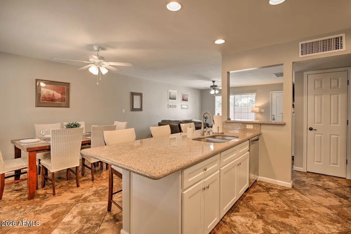 609 South Priest Drive Tempe, AZ 85281 - Photo 6 of 29 a kitchen that has a table and chairs in it