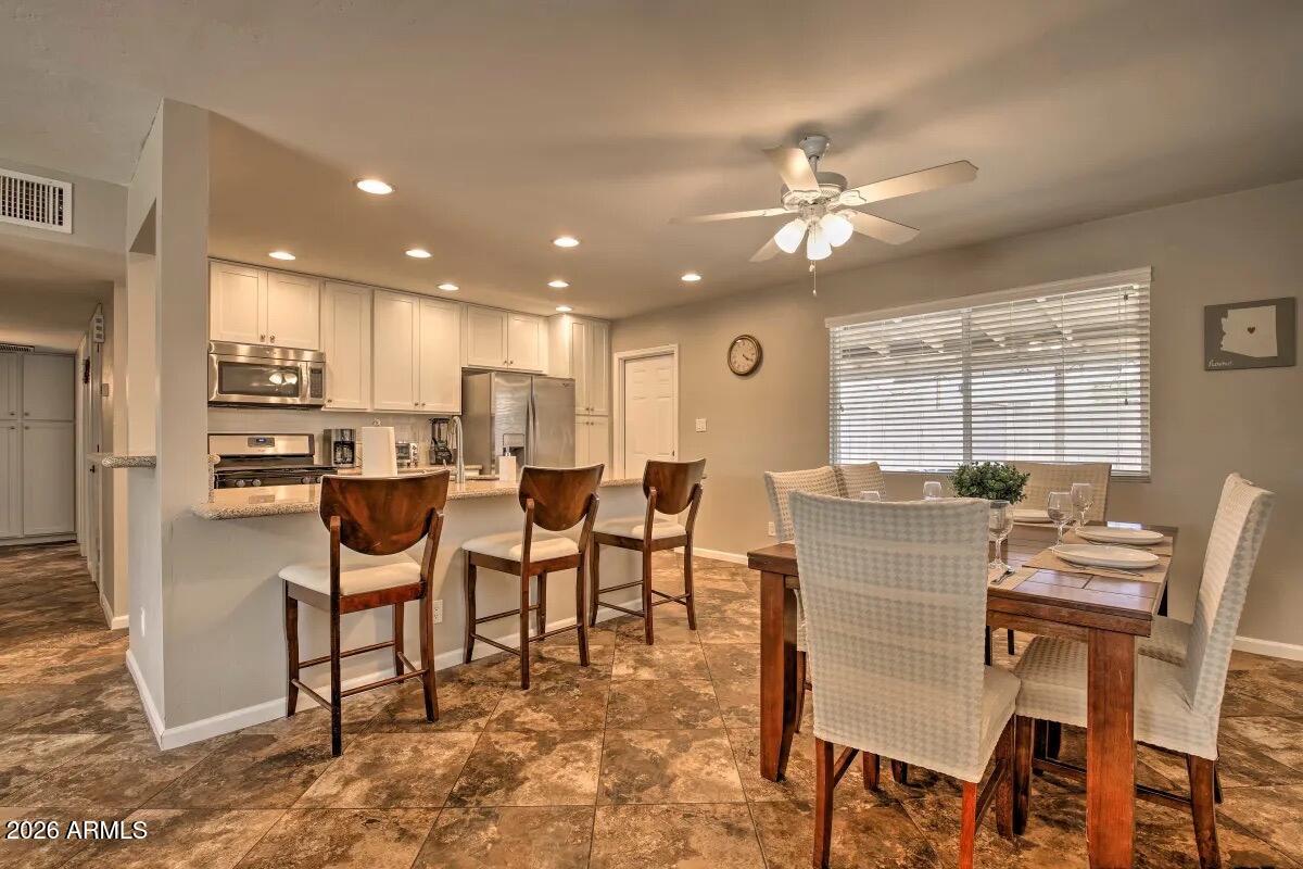 609 South Priest Drive Tempe, AZ 85281 - Photo 7 of 29 a view of a dining room with furniture