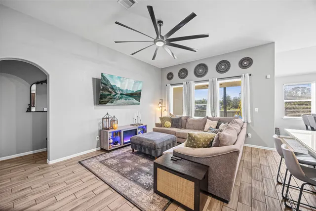 a kitchen with stainless steel appliances granite countertop a sink stove and wooden cabinets
