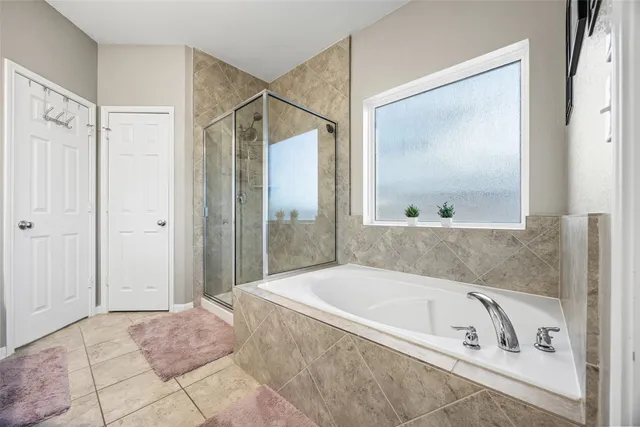 a bathroom with a glass shower door