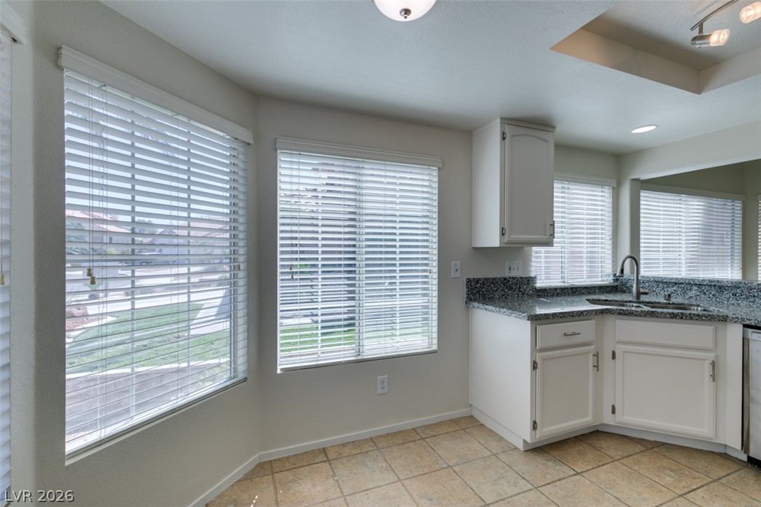 307 Cavalla Street Henderson, NV 89074 - Photo 25 of 44 A well-lit kitchen area features a practical sink and ample counter space.