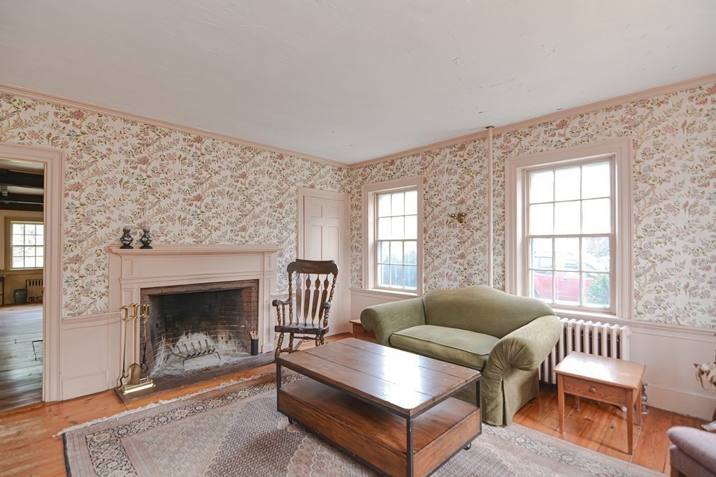 58 Hudson Road Sudbury, MA 01776 - Photo 13 of 42 a living room with furniture and a fireplace