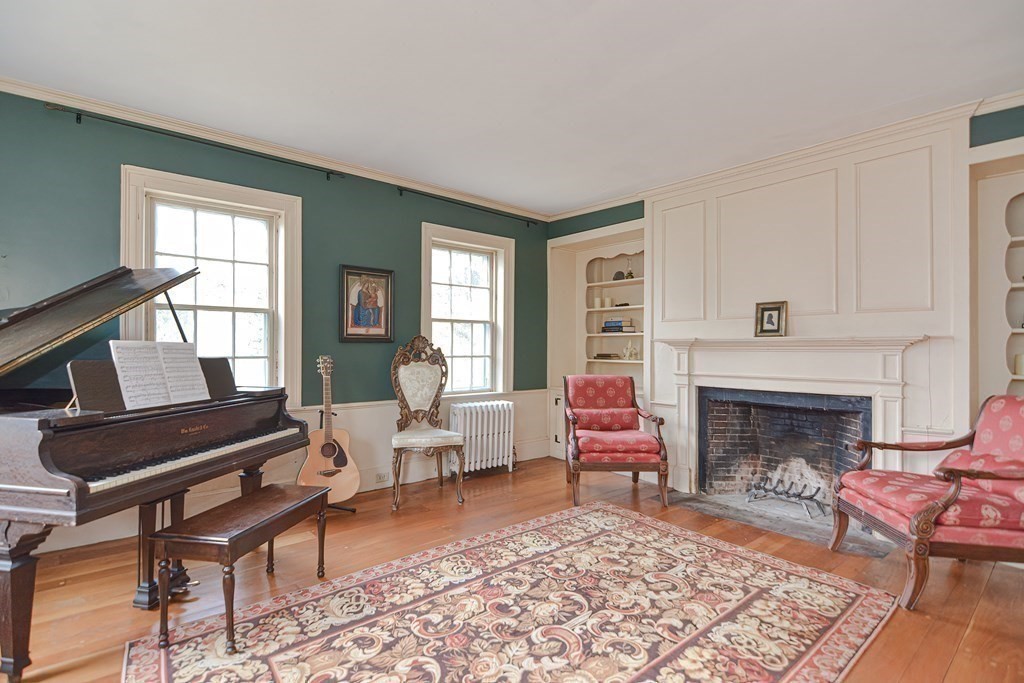 58 Hudson Road Sudbury, MA 01776 - Photo 15 of 42 a living room with furniture and a fireplace