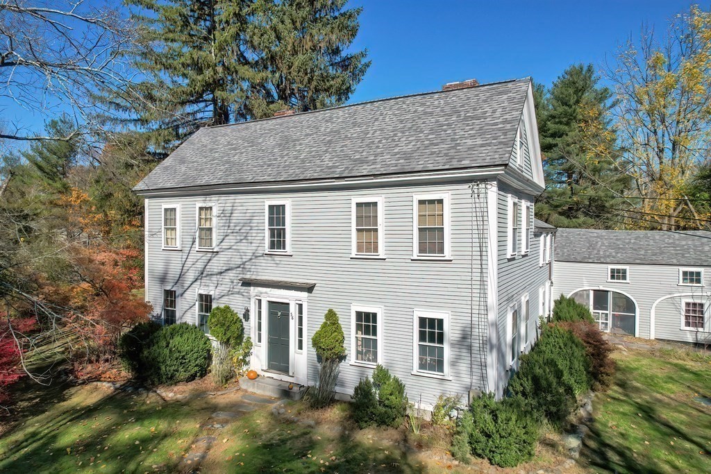 58 Hudson Road Sudbury, MA 01776 - Photo 2 of 42 a front view of a house with garden