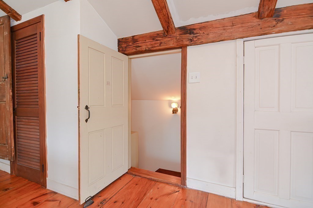 58 Hudson Road Sudbury, MA 01776 - Photo 28 of 42 a view of a hallway with wooden floor