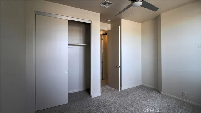 a bathroom with a granite countertop sink and window