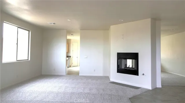 a view of an empty room and window