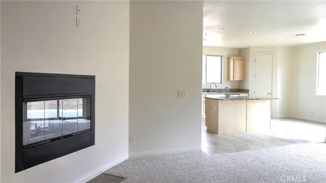 a view of a kitchen with granite countertop cabinets and a sink