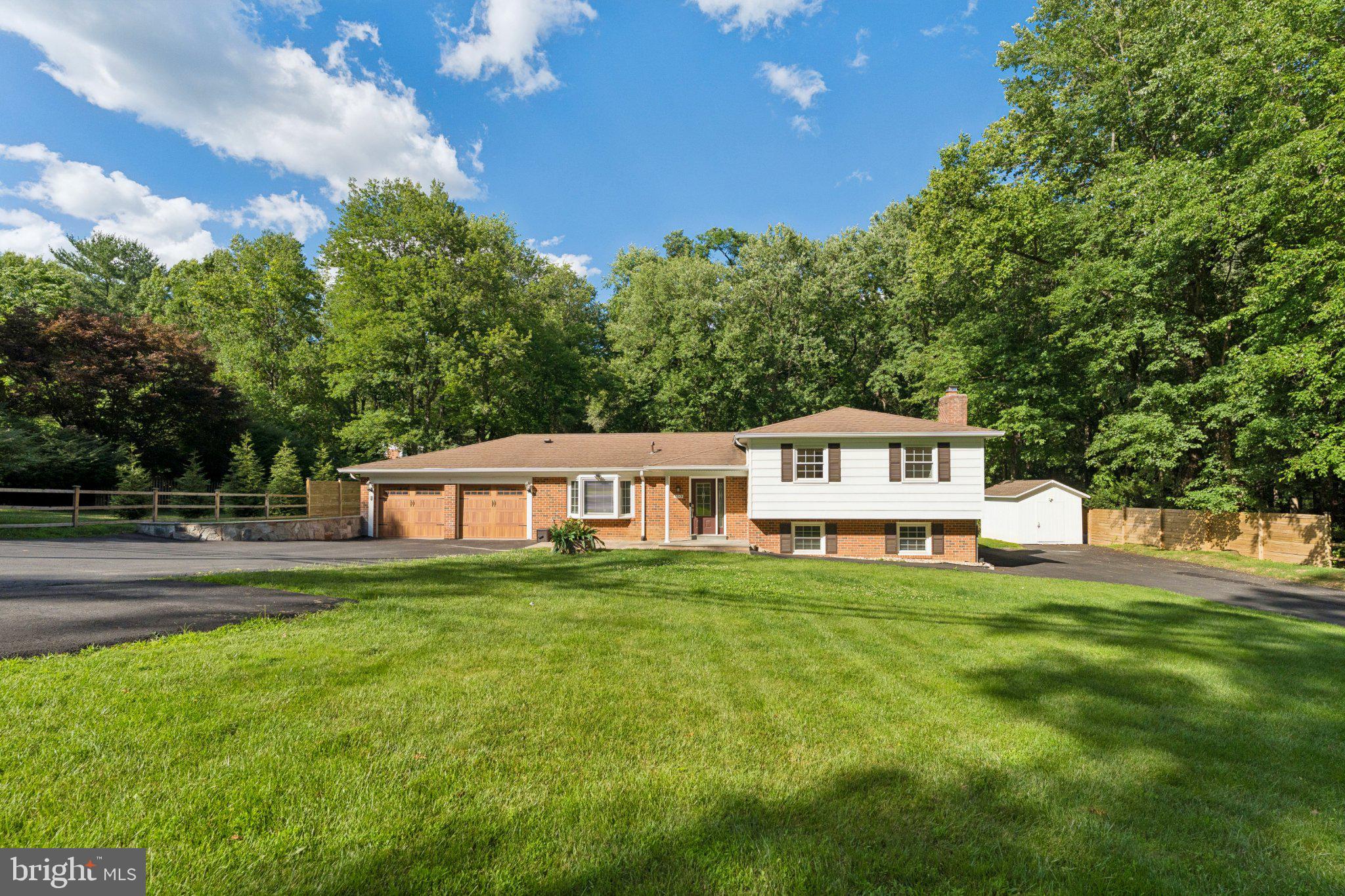 3219 Fox Mill Road Oakton, VA 22124 - Photo 2 of 87 Charming home nestled in lush greenery.